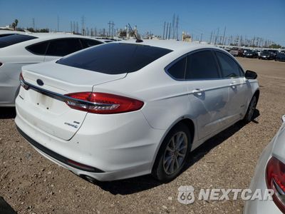 Trzecie zdjęcie samochodu z tyłu: 2017 FORD FUSION SE HYBRID VIN:3FA6P0LU2HR409705 - miniatura