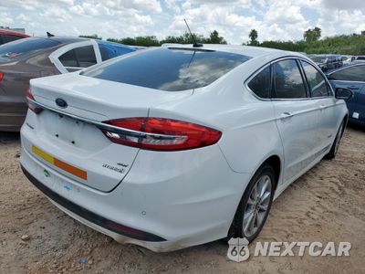 Trzecie zdjęcie samochodu z tyłu: 2017 FORD FUSION SE HYBRID VIN:3FA6P0LU1HR408979 - miniatura
