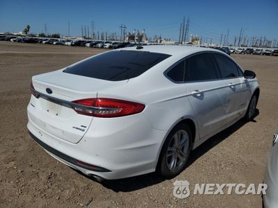 Trzecie zdjęcie samochodu z tyłu: 2018 FORD FUSION SE HYBRID VIN:3FA6P0LU5JR171578 - miniatura