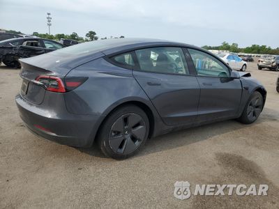 Trzecie zdjęcie samochodu z tyłu: 2023 TESLA MODEL 3 VIN:5YJ3E1EAXPF677557 - miniatura