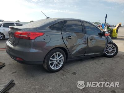 Trzecie zdjęcie samochodu z tyłu: 2017 FORD FOCUS SE VIN:1FADP3F24HL302060 - miniatura