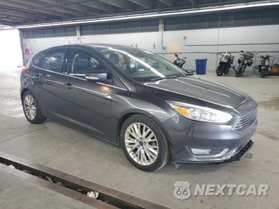 Czwarte zdjęcie samochodu z boku: 2017 FORD FOCUS TITANIUM VIN:1FADP3N22HL256987 - miniatura