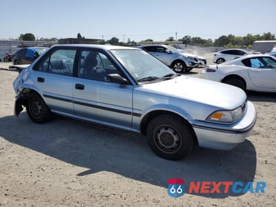 Czwarte zdjęcie samochodu z boku: 1991 TOYOTA COROLLA DLX VIN:1NXAE94A6MZ262645 - miniatura