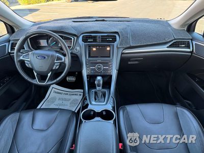 Zdjęcie 9 z 11 samochodu: 2016 FORD FUSION TITANIUM PHEV VIN:3FA6P0SUXGR320707 - miniatura