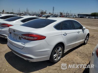Trzecie zdjęcie samochodu z tyłu: 2018 FORD FUSION SE HYBRID VIN:3FA6P0LU6JR118887 - miniatura