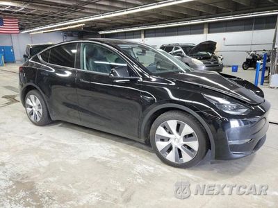Czwarte zdjęcie samochodu z boku: 2023 TESLA MODEL Y VIN:7SAYGDEE5PA195602 - miniatura