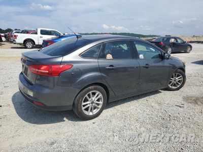 Trzecie zdjęcie samochodu z tyłu: 2017 FORD FOCUS SE VIN:1FADP3F21HL269471 - miniatura