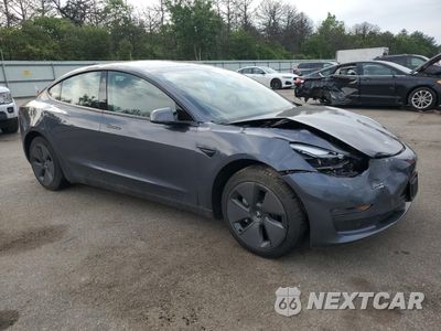 Czwarte zdjęcie samochodu z boku: 2023 TESLA MODEL 3 VIN:5YJ3E1EAXPF677557 - miniatura