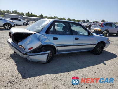 Trzecie zdjęcie samochodu z tyłu: 1991 TOYOTA COROLLA DLX VIN:1NXAE94A6MZ262645 - miniatura
