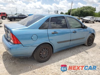 Trzecie zdjęcie samochodu z tyłu: 2001 FORD FOCUS LX VIN:1FAFP33P51W122583 - miniatura