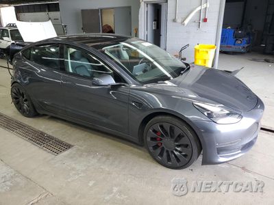 Czwarte zdjęcie samochodu z boku: 2022 TESLA MODEL 3 VIN:5YJ3E1EC2NF259010 - miniatura