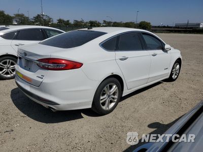 Trzecie zdjęcie samochodu z tyłu: 2018 FORD FUSION SE HYBRID VIN:3FA6P0LU1JR281866 - miniatura
