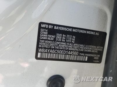 Zdjęcie 12 z 14 samochodu: 2014 BMW 740 I VIN:WBAYA6C50ED144560 - miniatura