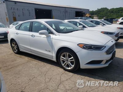 Czwarte zdjęcie samochodu z boku: 2018 FORD FUSION SE HYBRID VIN:3FA6P0LU0JR118724 - miniatura