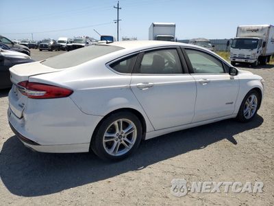 Trzecie zdjęcie samochodu z tyłu: 2018 FORD FUSION SE HYBRID VIN:3FA6P0LU1JR171562 - miniatura