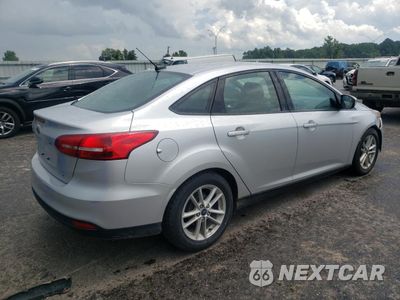Trzecie zdjęcie samochodu z tyłu: 2017 FORD FOCUS SE VIN:1FADP3F29HL315970 - miniatura