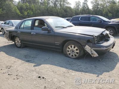Czwarte zdjęcie samochodu z boku: 1999 FORD CROWN VICTORIA LX VIN:2FAFP74W8XX125486 - miniatura