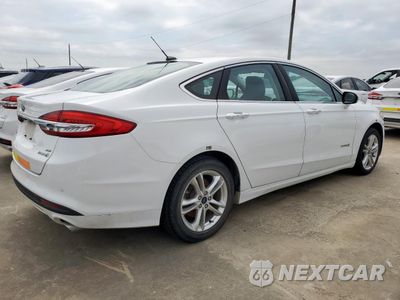 Trzecie zdjęcie samochodu z tyłu: 2018 FORD FUSION SE HYBRID VIN:3FA6P0LU7JR281905 - miniatura