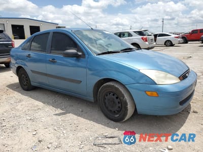 Czwarte zdjęcie samochodu z boku: 2001 FORD FOCUS LX VIN:1FAFP33P51W122583 - miniatura