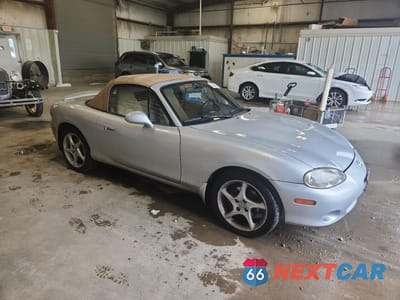 Czwarte zdjęcie samochodu z boku: 2002 MAZDA MX-5 MIATA BASE VIN:JM1NB353220231506 - miniatura