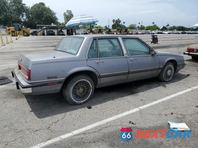 Trzecie zdjęcie samochodu z tyłu: 1990 BUICK LESABRE LIMITED VIN:1G4HR54C7LH524600 - miniatura