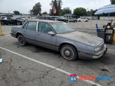 Czwarte zdjęcie samochodu z boku: 1990 BUICK LESABRE LIMITED VIN:1G4HR54C7LH524600 - miniatura
