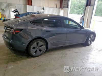 Trzecie zdjęcie samochodu z tyłu: 2022 TESLA MODEL 3 VIN:5YJ3E1EB3NF121239 - miniatura