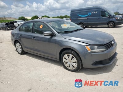 Czwarte zdjęcie samochodu z boku: 2005 VOLKSWAGEN JETTA SE VIN:3VWB07AJ6EM415835 - miniatura