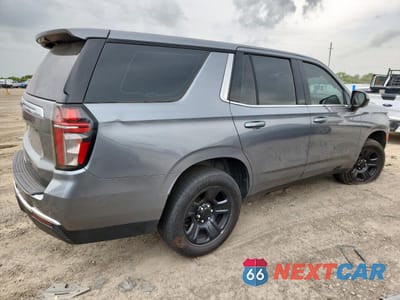 Trzecie zdjęcie samochodu z tyłu: 2022 CHEVROLET TAHOE C1500 VIN:1GNSCLED1NR290675 - miniatura