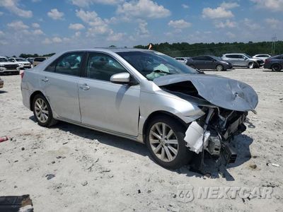Czwarte zdjęcie samochodu z boku: 2014 TOYOTA CAMRY XLE VIN:4T4BF1FK8ER389526 - miniatura