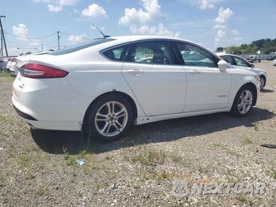 Trzecie zdjęcie samochodu z tyłu: 2018 FORD FUSION SE HYBRID VIN:3FA6P0LU1JR129859 - miniatura