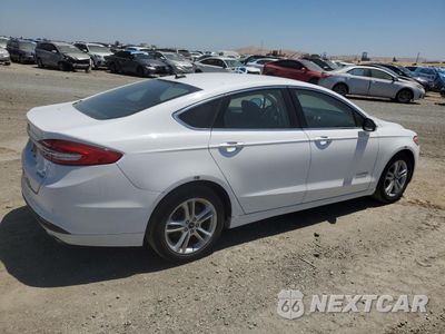 Trzecie zdjęcie samochodu z tyłu: 2018 FORD FUSION SE HYBRID VIN:3FA6P0LU0JR171553 - miniatura