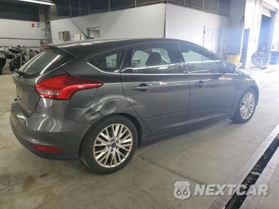 Trzecie zdjęcie samochodu z tyłu: 2017 FORD FOCUS TITANIUM VIN:1FADP3N22HL256987 - miniatura