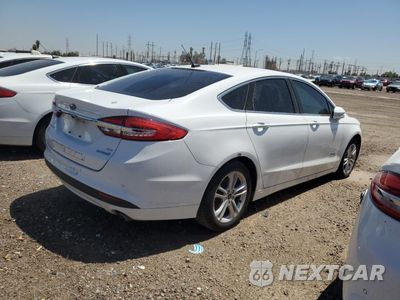 Trzecie zdjęcie samochodu z tyłu: 2018 FORD FUSION SE HYBRID VIN:3FA6P0LU5JR171614 - miniatura