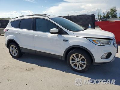 Czwarte zdjęcie samochodu z boku: 2017 FORD ESCAPE SE VIN:1FMCU9G90HUA30948 - miniatura