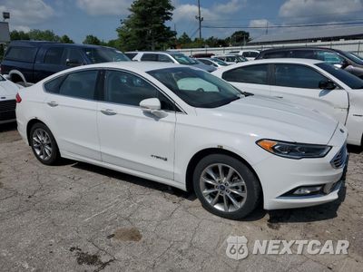 Czwarte zdjęcie samochodu z boku: 2017 FORD FUSION SE HYBRID VIN:3FA6P0LU4HR400746 - miniatura