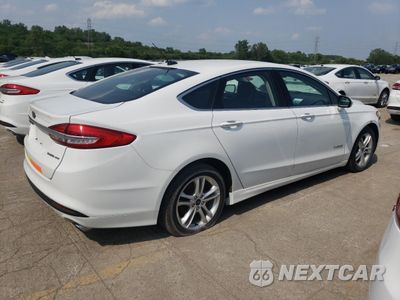 Trzecie zdjęcie samochodu z tyłu: 2018 FORD FUSION SE HYBRID VIN:3FA6P0LU0JR129853 - miniatura