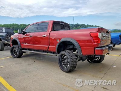 Trzecie zdjęcie samochodu z tyłu: 2017 NISSAN TITAN XD PLATINUM RESERVE VIN:1N6AA1F42HN569557 - miniatura