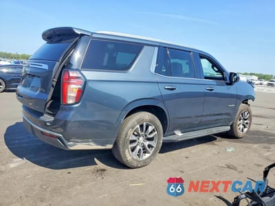 Trzecie zdjęcie samochodu z tyłu: 2021 CHEVROLET TAHOE C1500 LT VIN:1GNSCNKD9MR236748 - miniatura