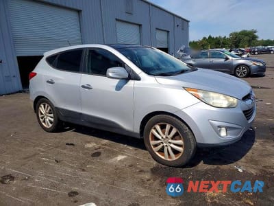 Czwarte zdjęcie samochodu z boku: 2012 HYUNDAI TUCSON LIMITED VIN:KM8JU3AC2CU487035 - miniatura
