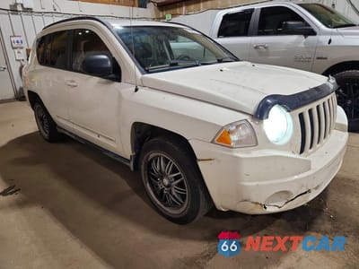 Czwarte zdjęcie samochodu z boku: 2010 JEEP COMPASS SPORT VIN:1J4NT4FA8AD506863 - miniatura