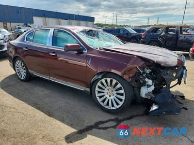 Czwarte zdjęcie samochodu z boku: 2015 LINCOLN MKS VIN:1LNHL9EK3FG604968 - miniatura