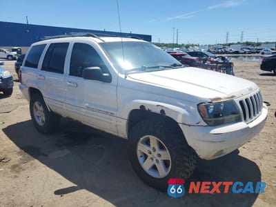 Czwarte zdjęcie samochodu z boku: 1999 JEEP GRAND CHEROKEE LIMITED VIN:1J4GW68N5XC696289 - miniatura