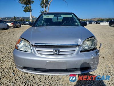 Piąte zdjęcie samochodu w środku: 2003 HONDA CIVIC LX VIN:2HGES16533H511809 - miniatura