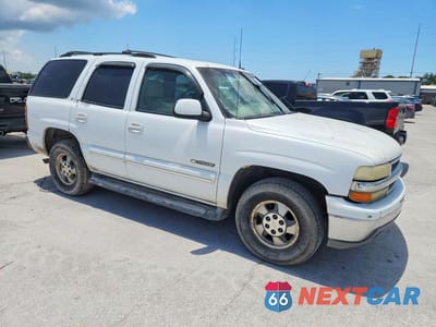 Czwarte zdjęcie samochodu z boku: 2002 CHEVROLET TAHOE C1500 VIN:1GNEC13Z82R325160 - miniatura