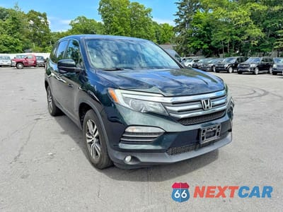 Czwarte zdjęcie samochodu z boku: 2018 HONDA PILOT EXL VIN:5FNYF6H57JB012590 - miniatura