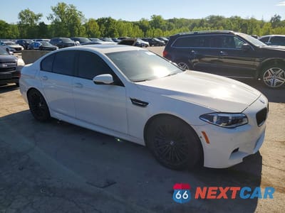 Czwarte zdjęcie samochodu z boku: 2014 BMW M5 VIN:WBSFV9C59ED593292 - miniatura