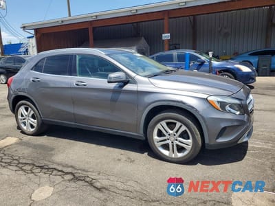 Czwarte zdjęcie samochodu z boku: 2015 MERCEDES-BENZ GLA 250 4MATIC VIN:WDCTG4GB0FJ182836 - miniatura