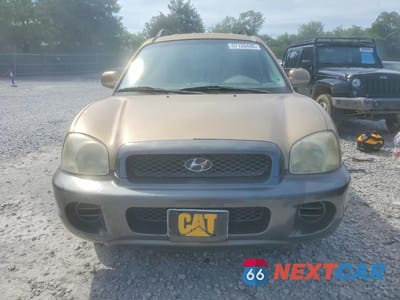 Piąte zdjęcie samochodu w środku: 2003 HYUNDAI SANTA FE VIN:KM8SB12B63U429370 - miniatura