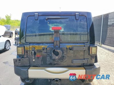 Zdjęcie 6 z 12 samochodu: 2014 JEEP WRANGLER UNLIMITED SAHARA VIN:1C4BJWEGXEL324111 - miniatura